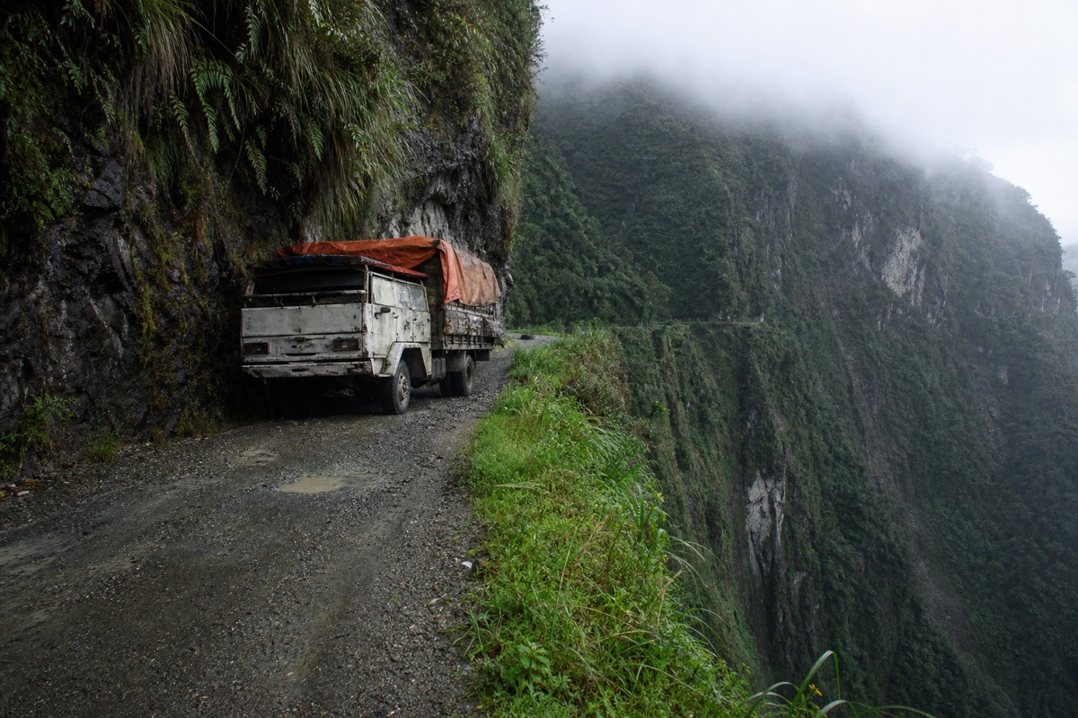 A vehicle-width narrow pass on the North Yungas Road Bolivia with a sheer drop to one side