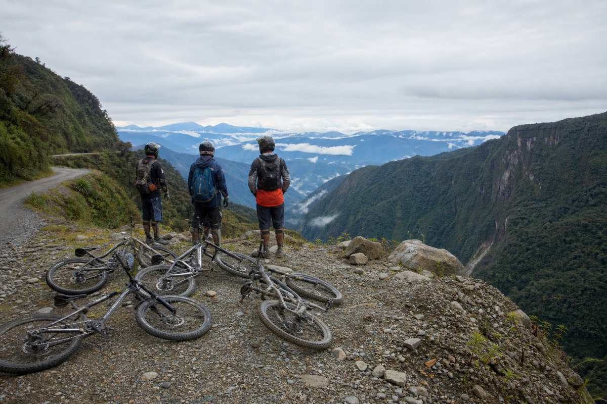 Death Road Bolivia bike tour group of mountain bikers stopped for a rest on the road